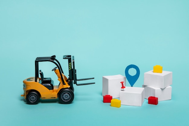 Free photo forklift and boxes arrangement