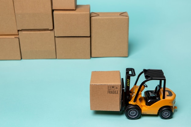 Free photo forklift carrying box supply chain representation