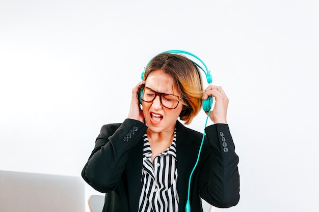 Free photo formal woman suffering from loud noise