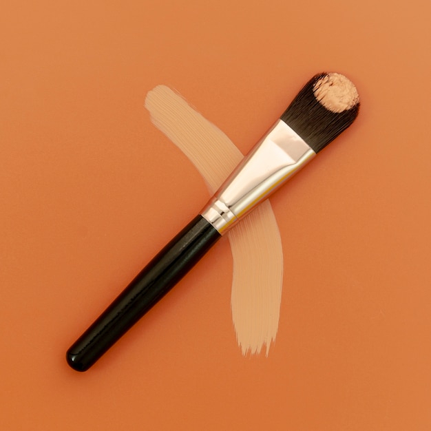 Foundation brush on brown background