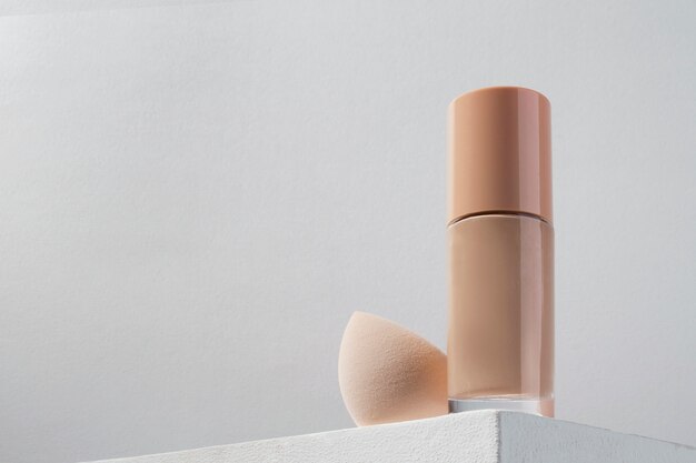 Foundation container and beauty blender