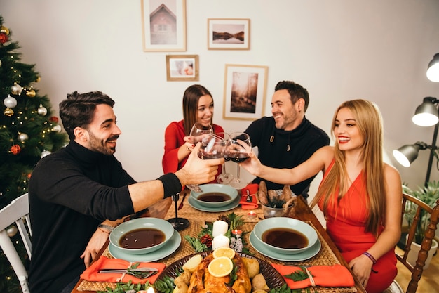 Four friends dining at christmas