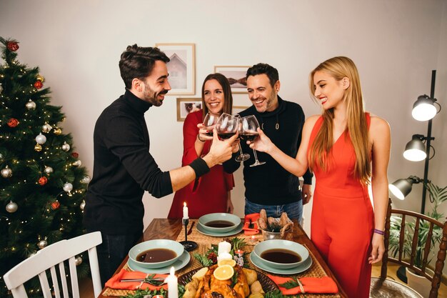 Four friends dining at christmas