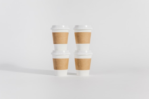 Four plastic coffee cups