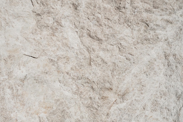 Fragment of a block of white raw marble Marble factory depot working stone in Turkey Selective focus