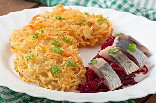 Fragrant potato pancakes  and herring with beetroot