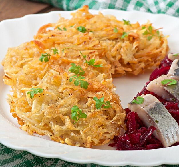 Fragrant potato pancakes  and herring with beetroot