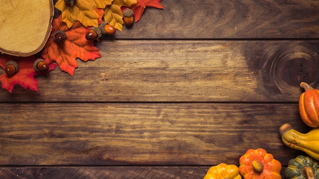 Frame of autumn leaves and pumpkins 