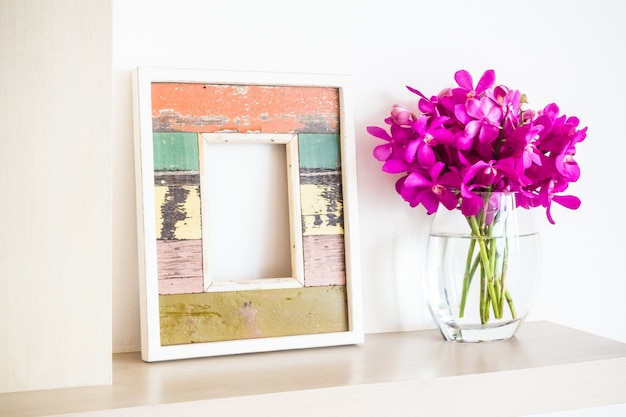 Frame and flower pot with flowers