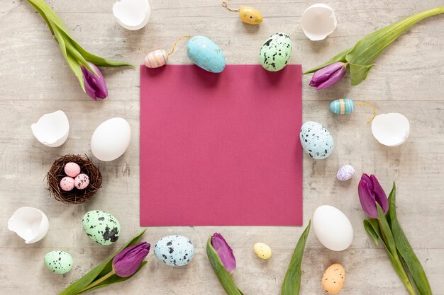 Frame of flowers and eggs for easter