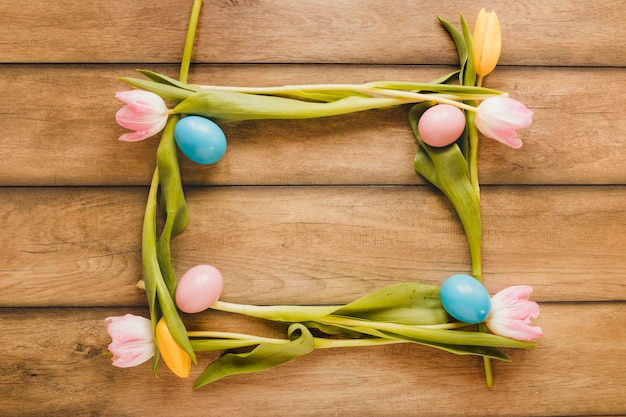 Free photo frame from eggs and tulips