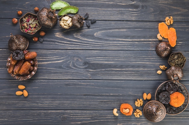 Frame made of different dried fruits with nuts 