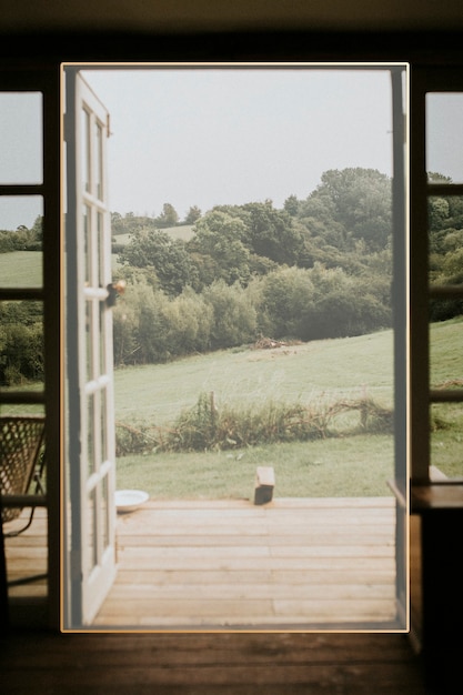 Free photo frame on an opened door to nature background