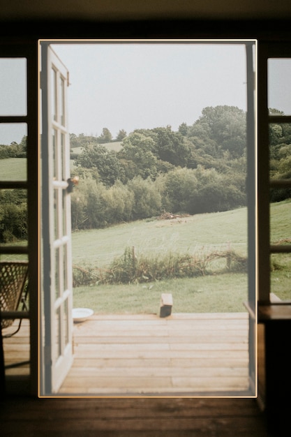 Frame on an opened door to nature background