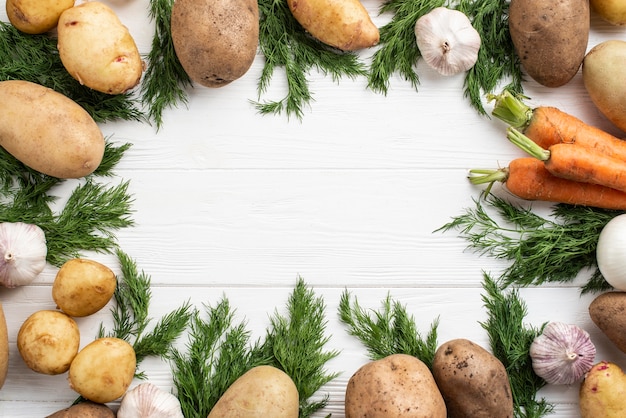 Frame of potatoes and carrot