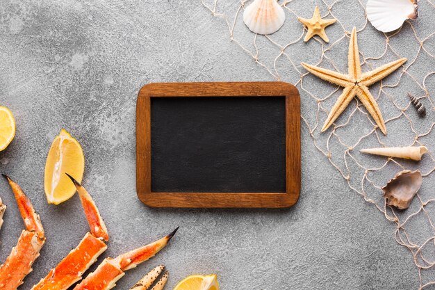 Frame surrounded by seafood on table