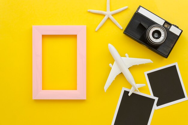 Frame with camera and airplane beside