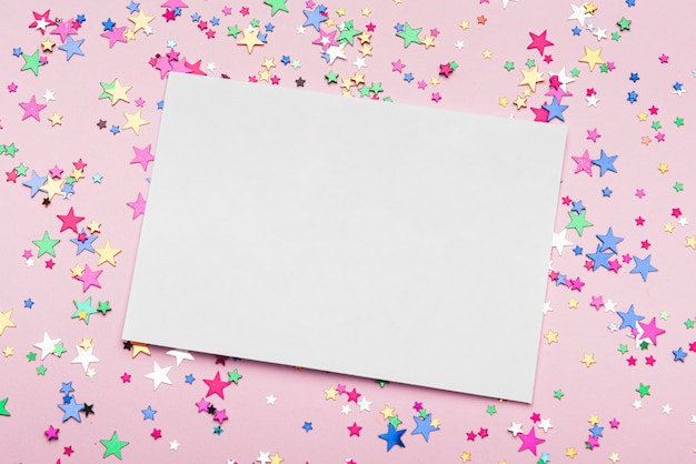 Free photo frame with colorful confetti stars on pink background