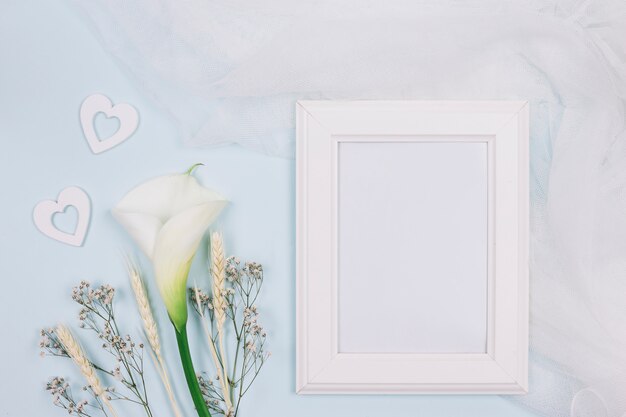 Frame with flowers and bridal veil