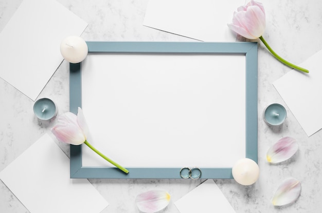 Frame with flowers and candles