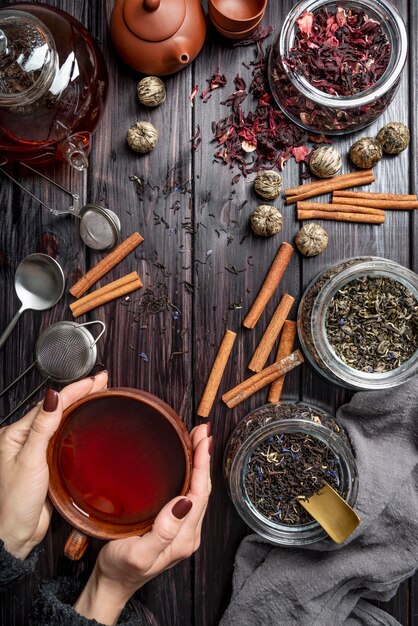 Frame with tea cup and herbs