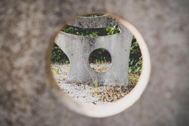 Frame within a frame shot of a concrete structure through a round frame