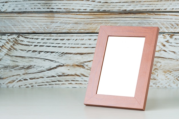 Free photo frame on wood table