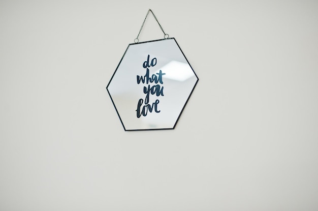 Free photo framed picture with motivational saying on it on light background
