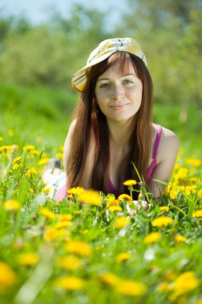 freckle woman relaxing in dandelion