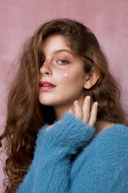 Free photo freckled woman with white flowers on her face