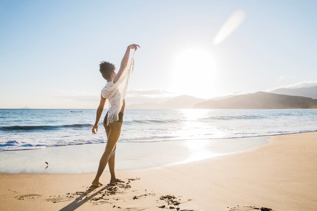 Freedom concept of woman at the beach