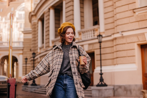 Freedom-loving woman explores city with pleasure