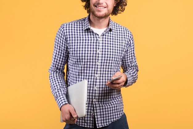 Freelance concept with man holding laptop