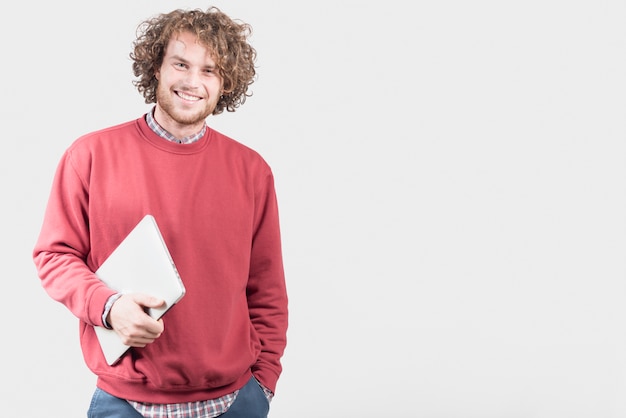 Freelance concept with man holding laptop