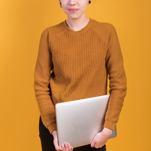 Free photo freelance concept with woman holding laptop