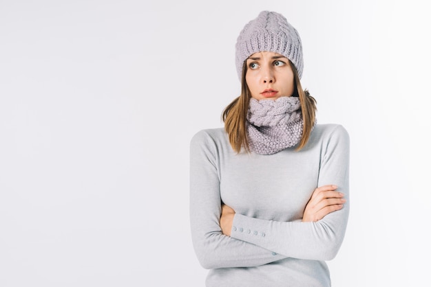 Freezing woman in scarf and hat