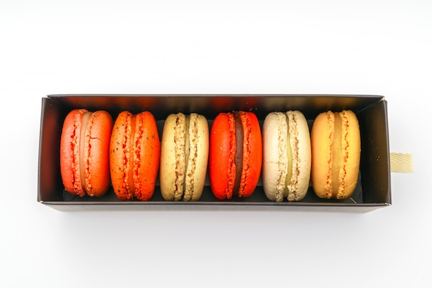 French colorful macarons on white background .