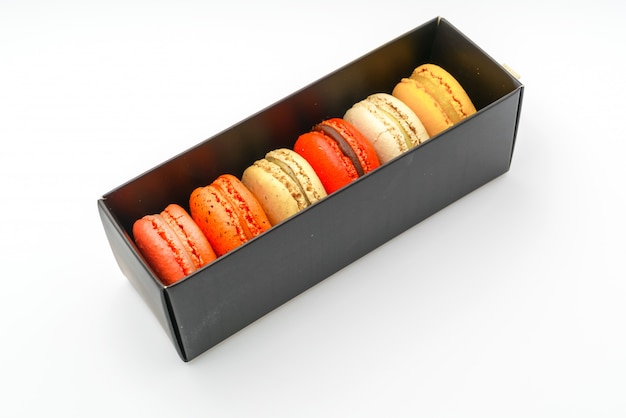 French colorful macarons on white background .