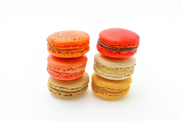 French colorful macarons on white background .