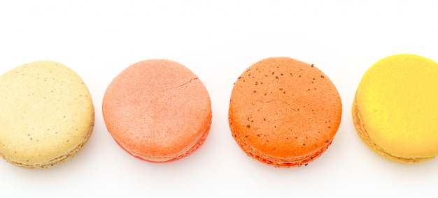 Free photo french colorful macarons on white background .