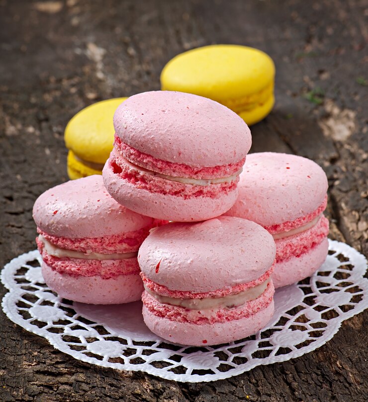 Free Photo french colorful macaroons on a wooden background