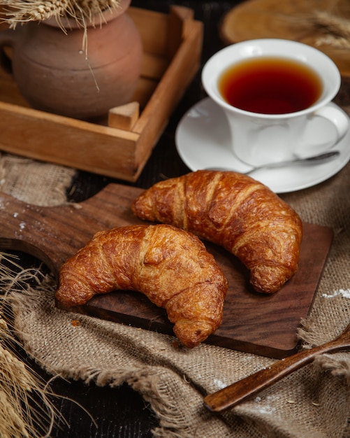 French croissants with a cup of tea.