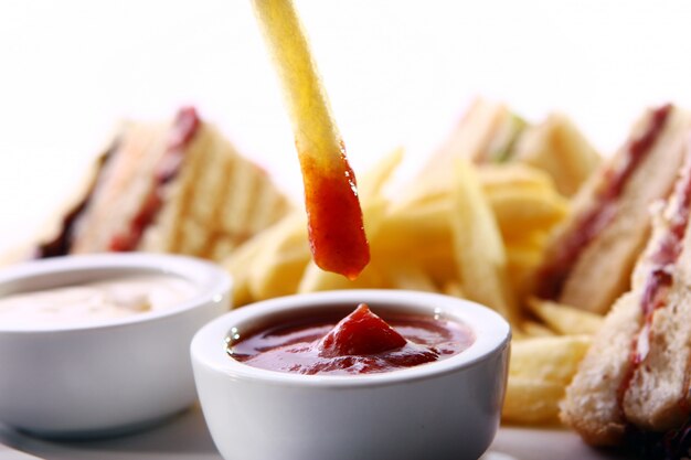 French frie wedge in a sauce 