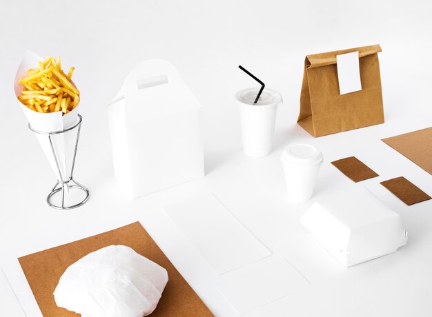 French fries and packed food on white background