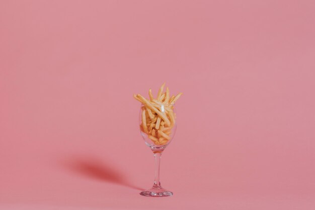 French fries on pink