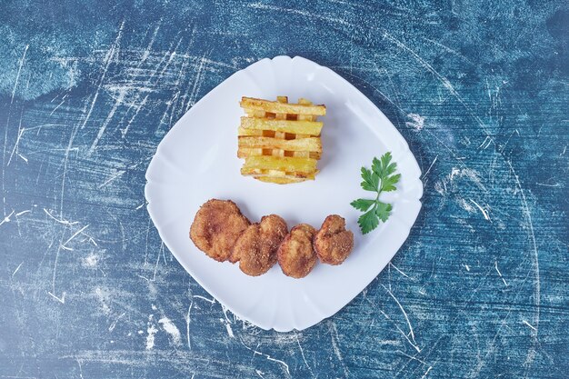 French fries with crispy nuggets.