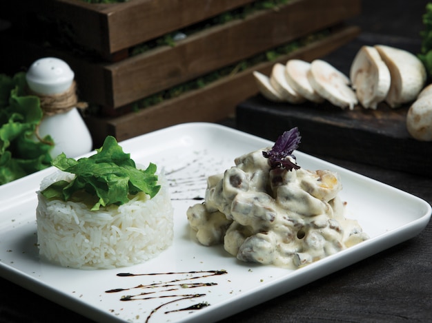 Free photo french kitchen mushroom sauteed in cream sauce with rice