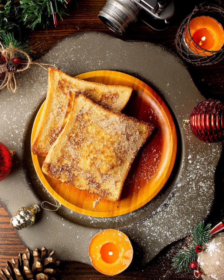 Free Photo french toasts on a wooden plate