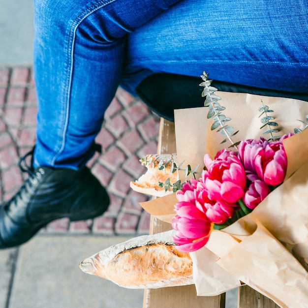 French woman in a red beret on a street bench