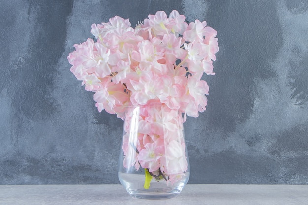 Free photo fresh beautiful fragrance flowers in a jug, on the white table.